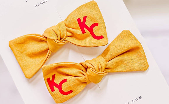Gold KC Pigtail Knot Bow
